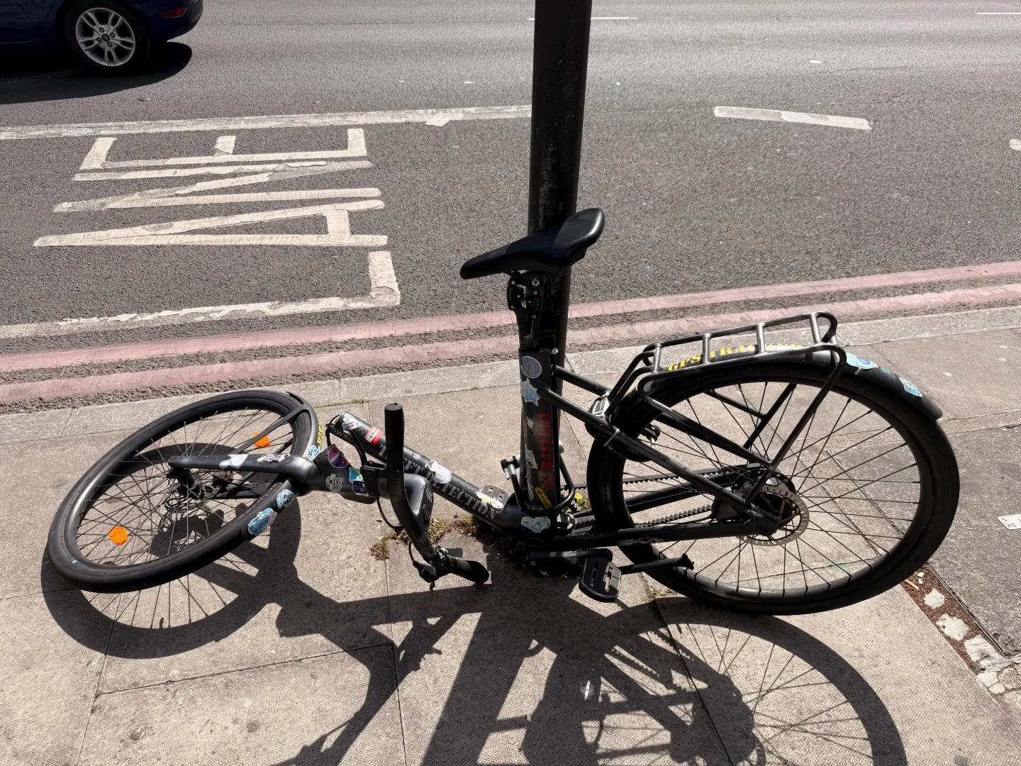 The Cowboy bike collapsed against a pole on a London street, the front of the frame folded under after the failure.